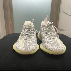 Never Used with tags Yeezy shoes. Grey and White Size 4.5 US